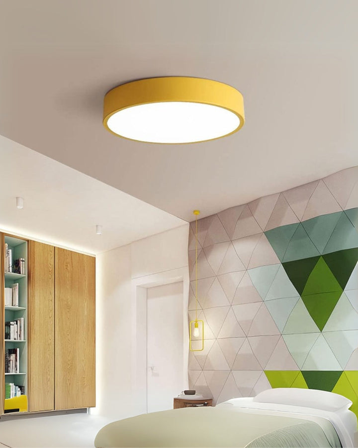 Contemporary apartment hallway lit by a minimalist round LED lamp
