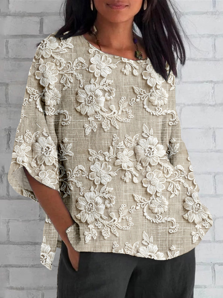 Woman wearing a vintage-inspired khaki floral embroidered top with half sleeves.