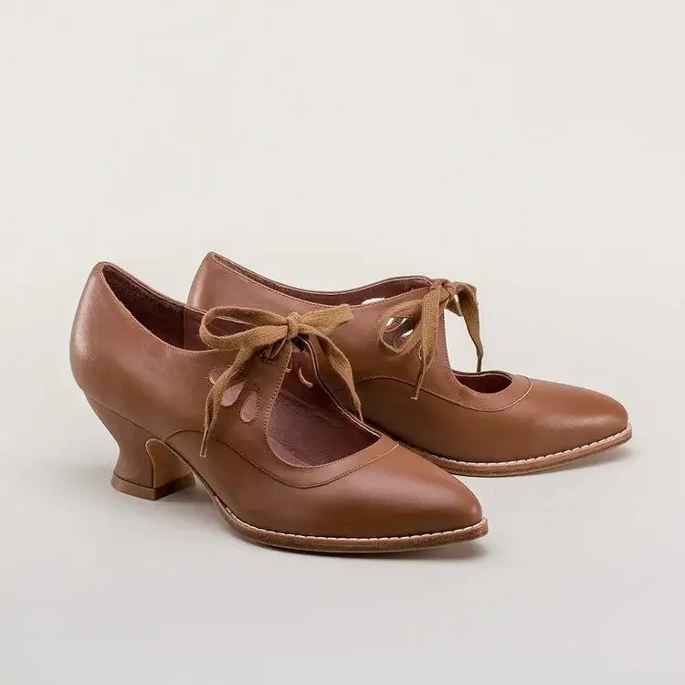Lifestyle shot of a woman wearing comfortable low heels with arch support for daily walking.