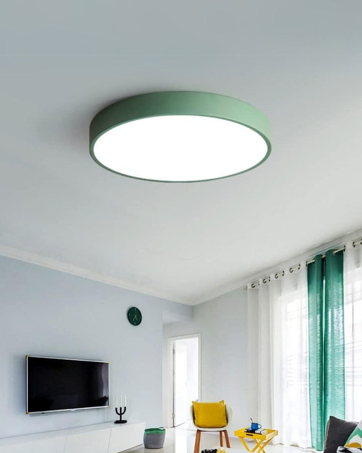Clean geometric lines of a round LED ceiling lamp in a modern office
