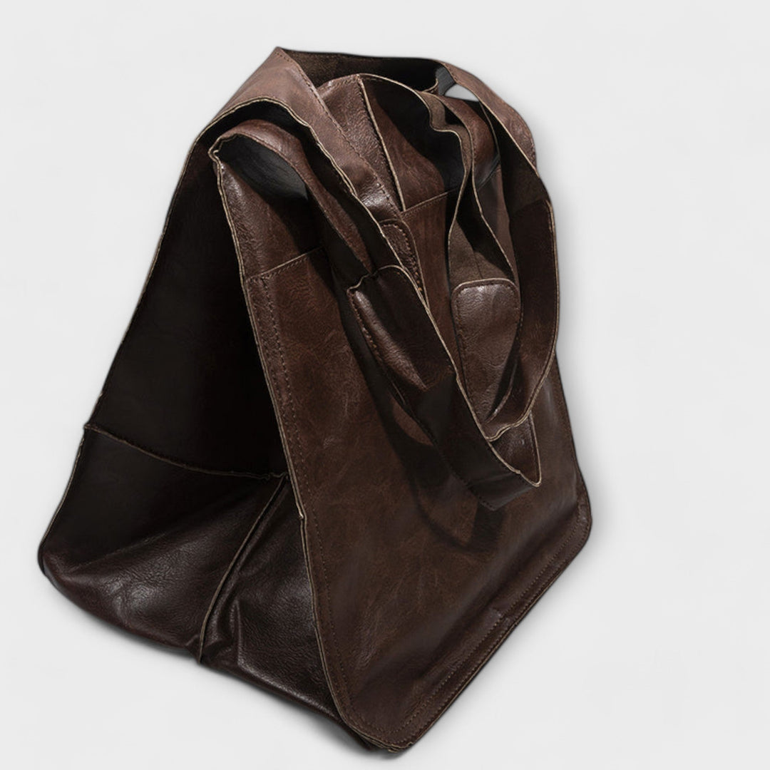 Brown everyday tote bag highlighting the generous interior capacity and soft finish