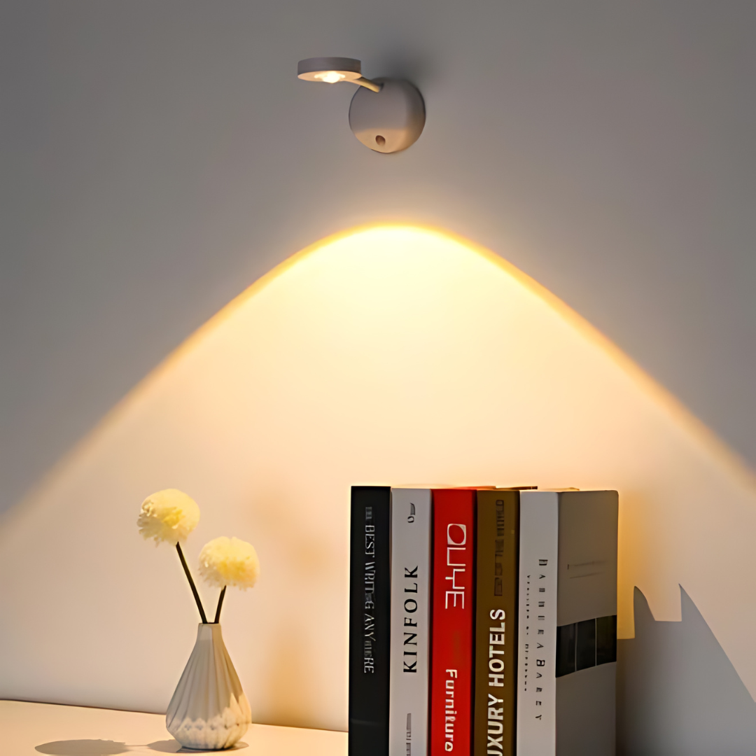 Wireless LED spotlight with motion sensor mounted on a hallway wall for smart home lighting.