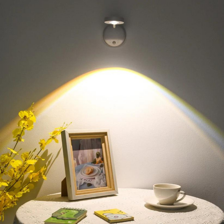 Angle shot of the battery-operated LED light fixture showing its adjustable mounting bracket.