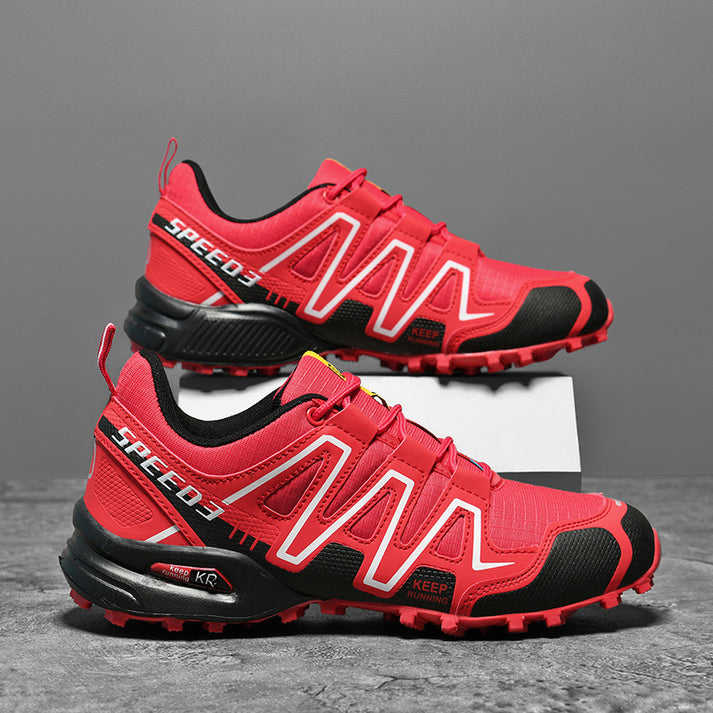 Close-up of red and black men's hiking shoes with patterned side design