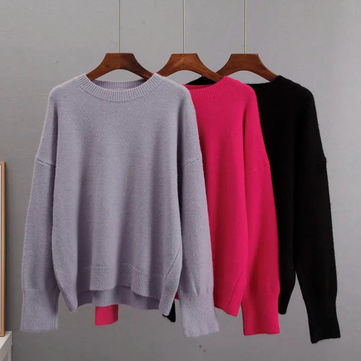 Back view of the blue women's jumper featuring a classic knit pullover design