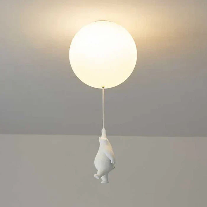 Modern kids room decor ceiling light fixture switched on in a dark room