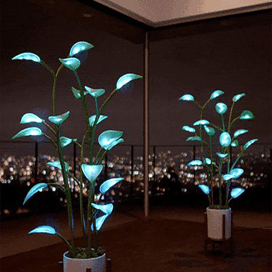 Two indoor LED plant lamps glowing with soothing blue illumination at night.