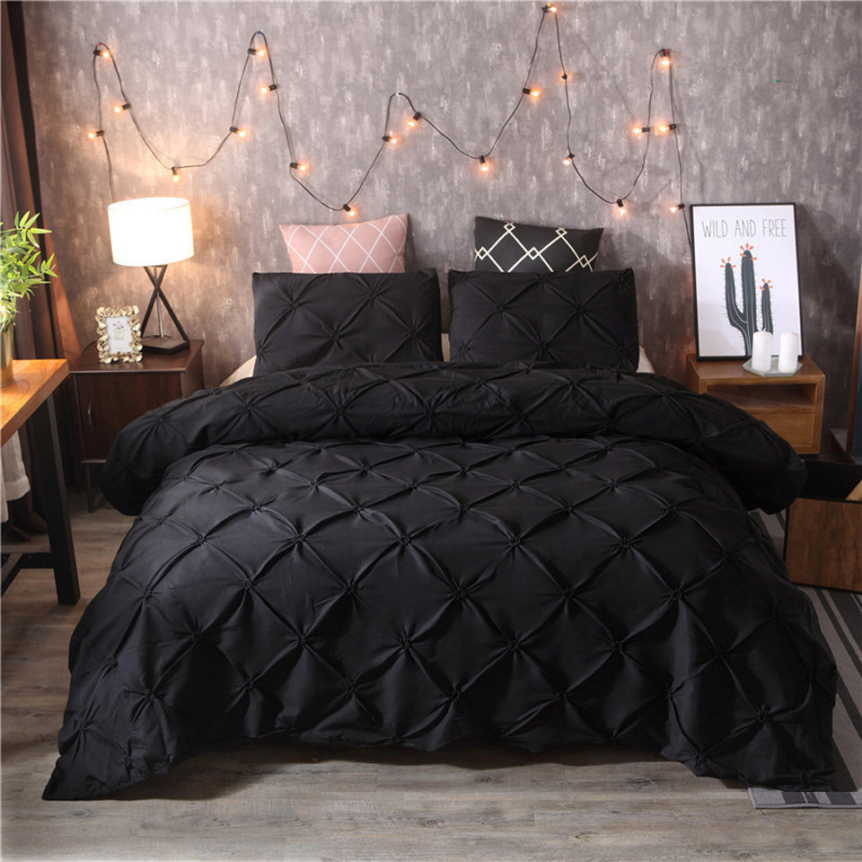 Black microfiber duvet cover set displayed on a double bed in a cozy bedroom