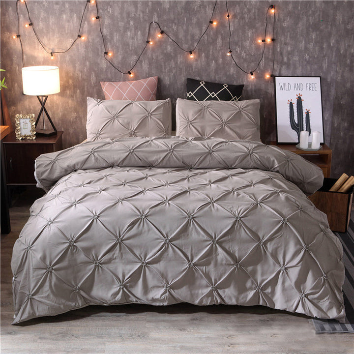 Solid color microfiber duvet cover set folded neatly to show soft luxe fabric and bedroom decor