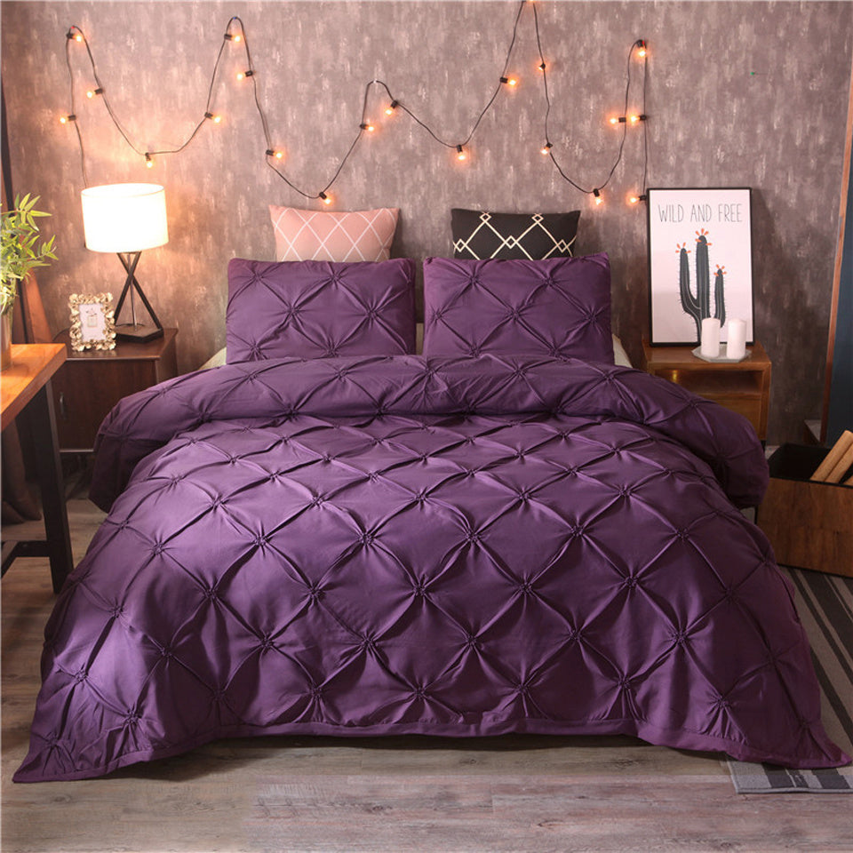 Close-up of breathable home textiles and soft bedding showing fine stitching on duvet cover