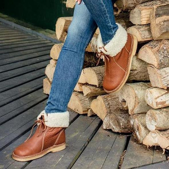 Classic silhouette of women's cold weather style boots in neutral tone