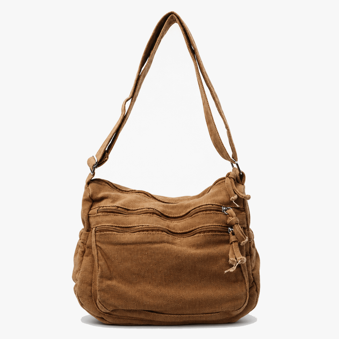 Model carrying camel brown soft washed canvas tote bag outdoors