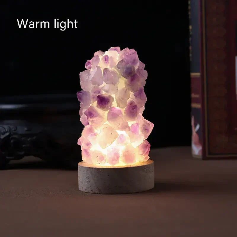 Amethyst crystal lamp displaying warm light setting in a cozy room