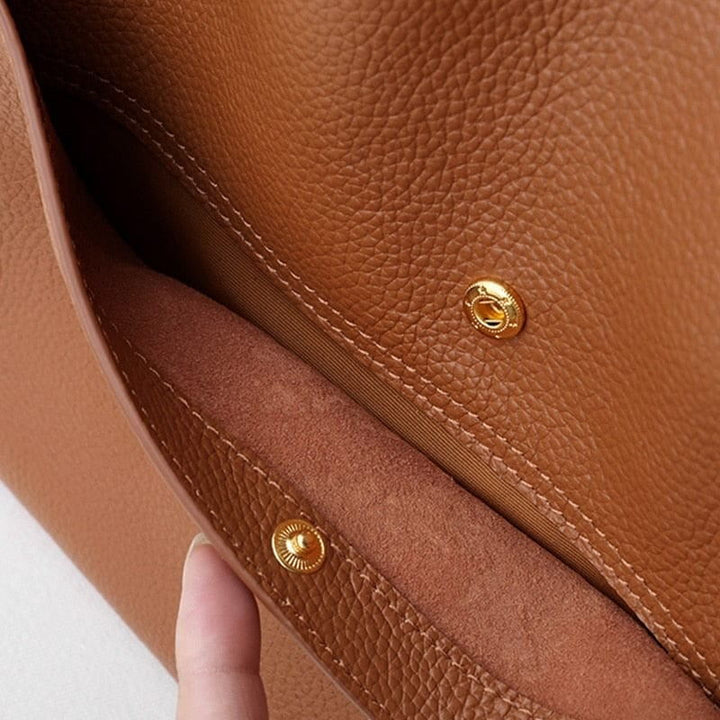 Khaki women's accessory bag featuring structured shape and comfortable straps