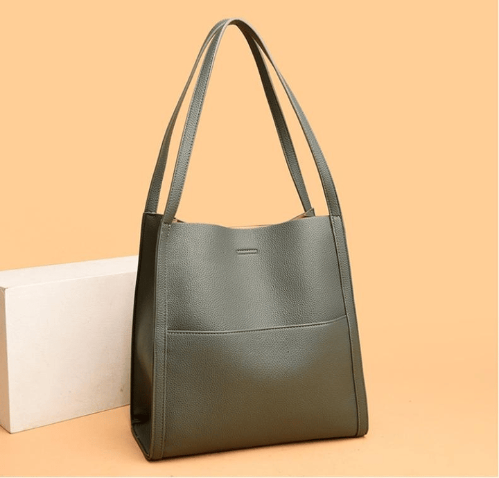 Close-up of black women's tote bag zipper and premium hardware detail