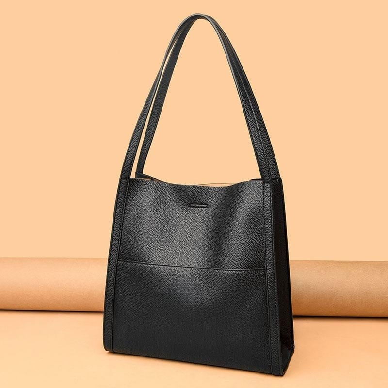Interior view of grey women's handbag with multiple pockets for organization