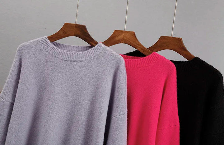 Detailed shot of the ribbed collar on the green oversized knit sweater