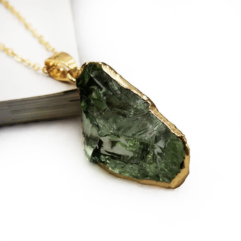 Unique handcrafted raw gemstone jewelry with a genuine green Moldavite stone