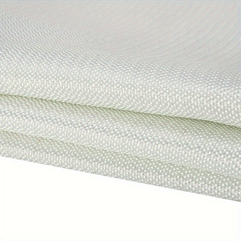 Compact emergency safety fire blanket hanging securely on a kitchen wall