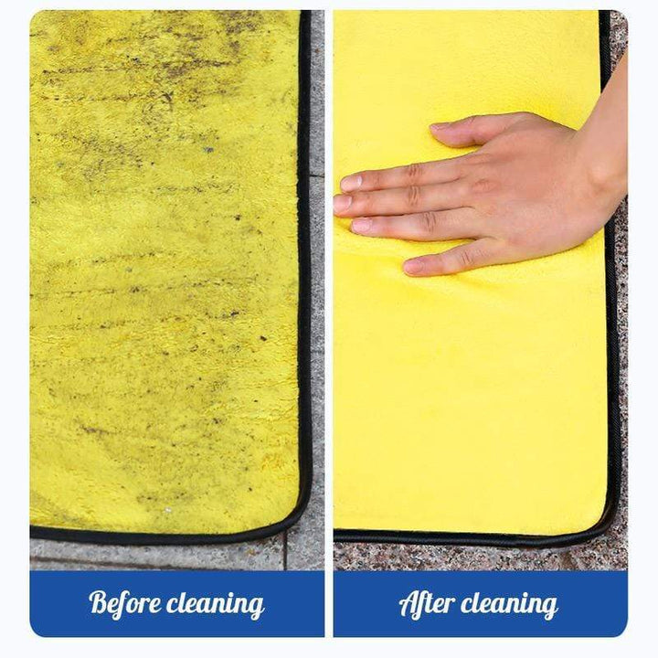 Absorbent microfiber car towel absorbing water droplets quickly from vehicle paint.