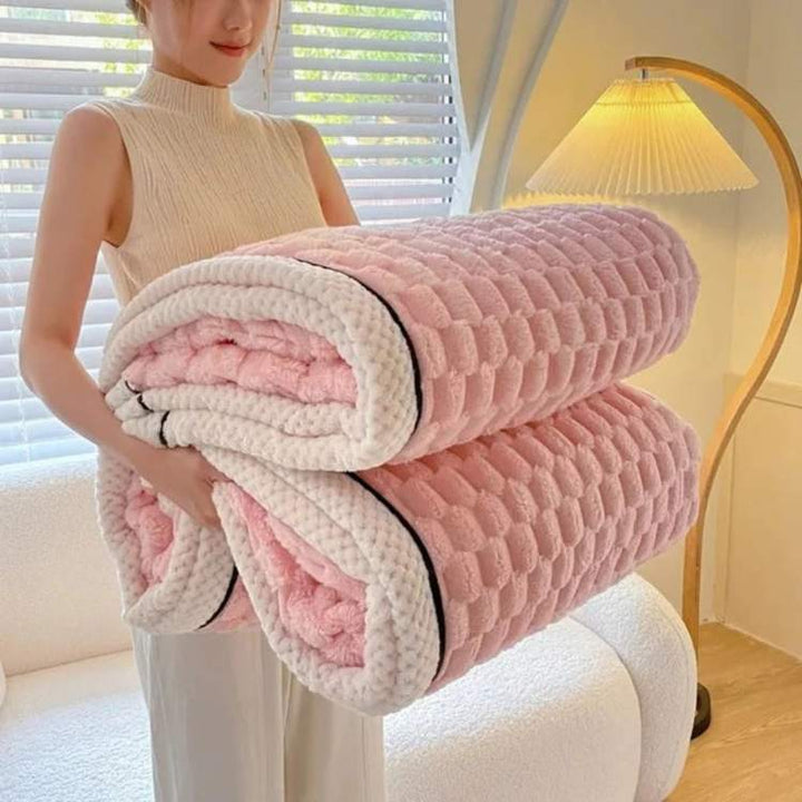 Folded heavy throw blanket demonstrating plush texture and quality finish