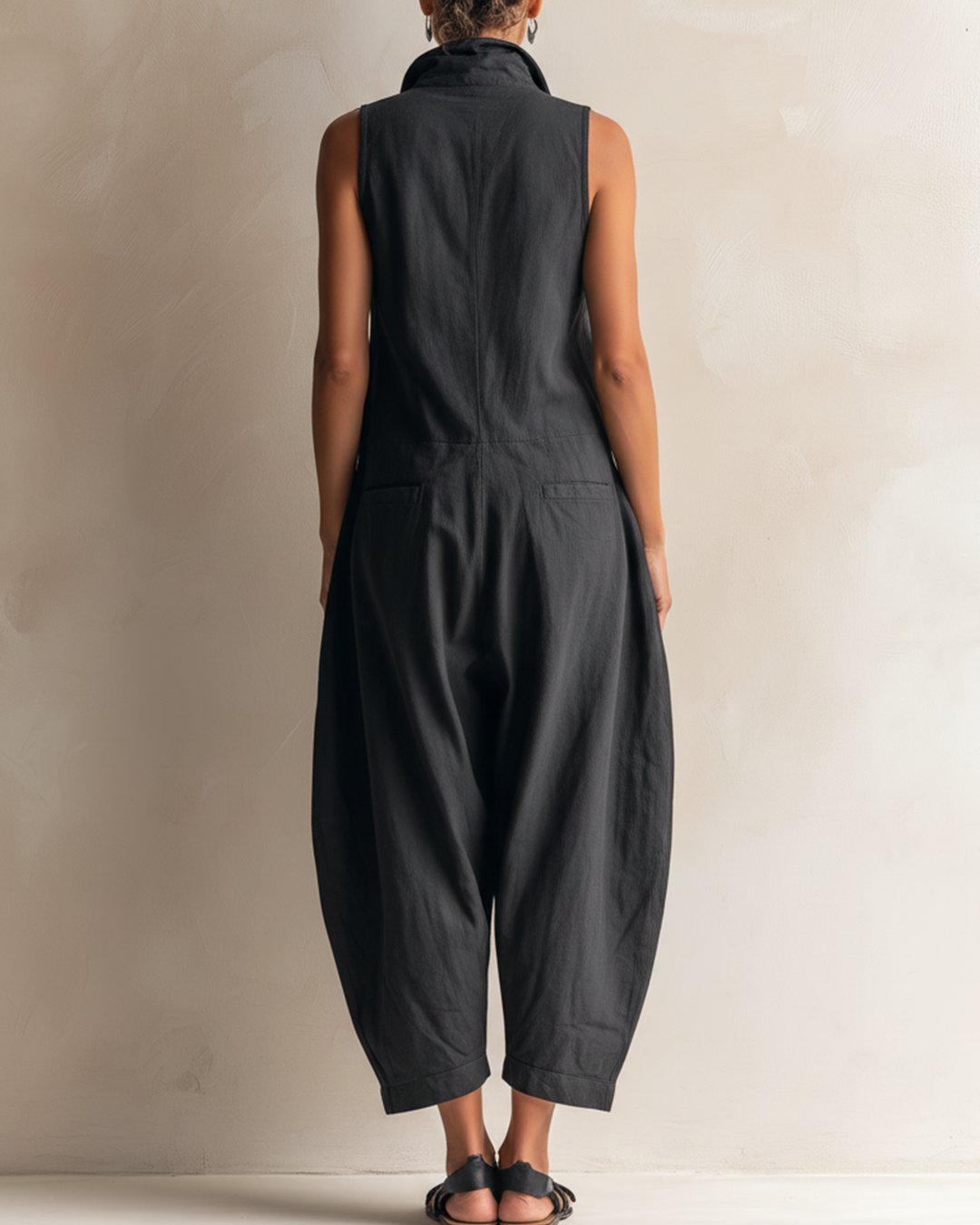 Detailed shot of functional chest pocket on the summer utility jumpsuit