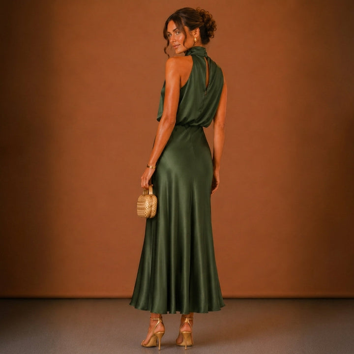 Green halter maxi dress back view showcasing elegant evening gown design and party wear style