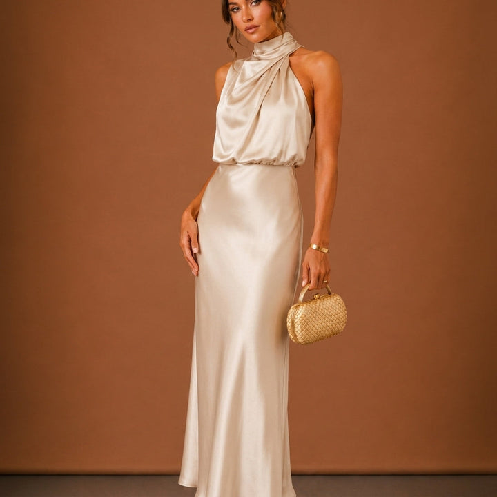 Close-up of the halterneck on the green women's maxi dress highlighting formal wear details