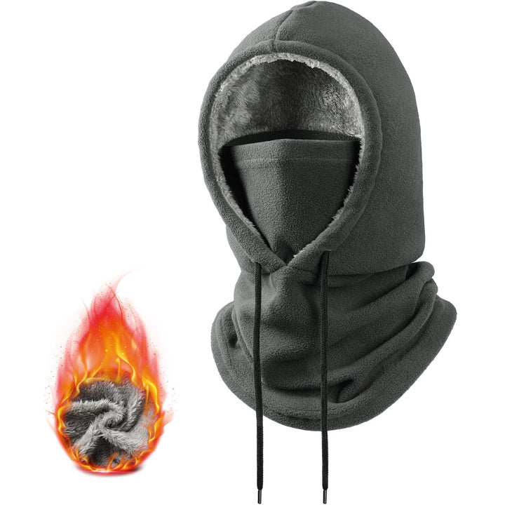 Outdoor action shot of hiker wearing windproof fleece balaclava in winter
