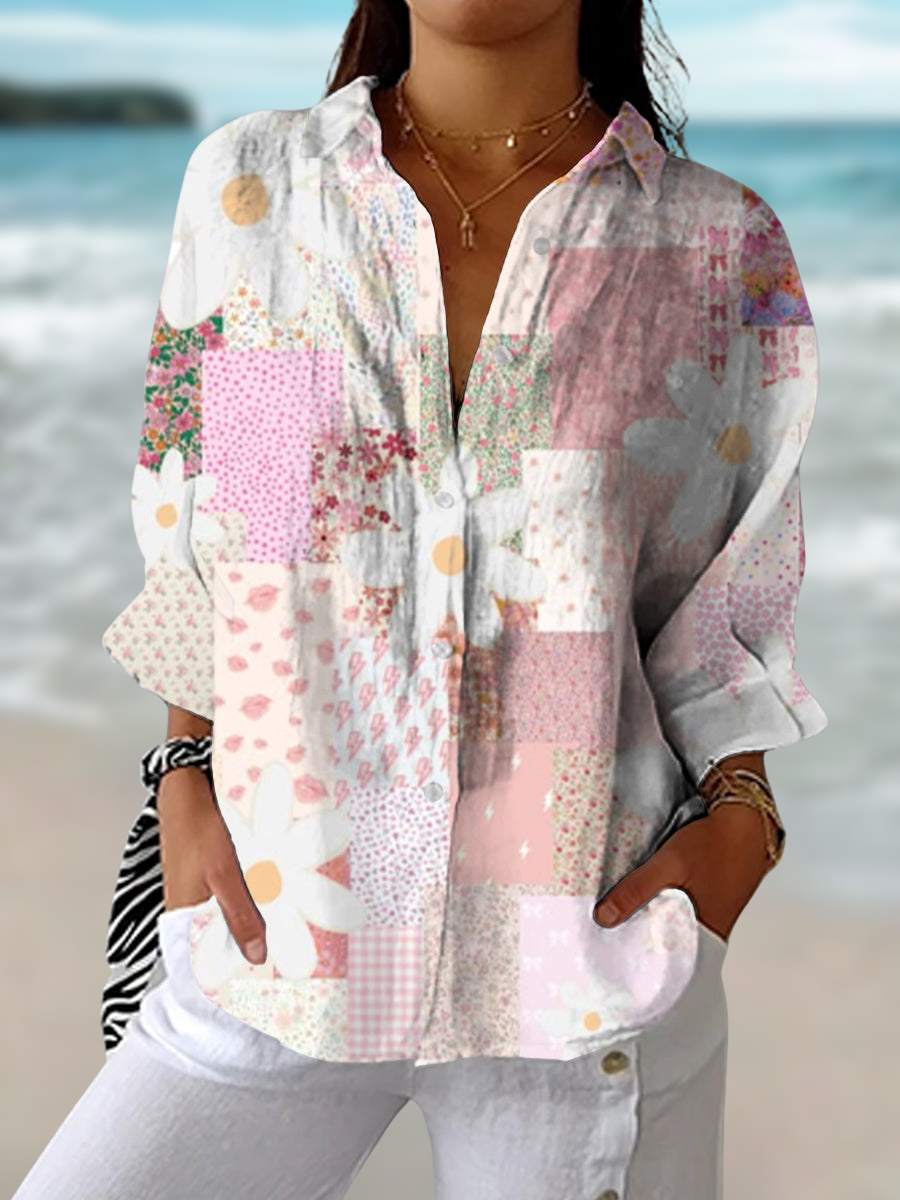 Woman wearing a multicolour patchwork daisy blouse with button-down front by the beach