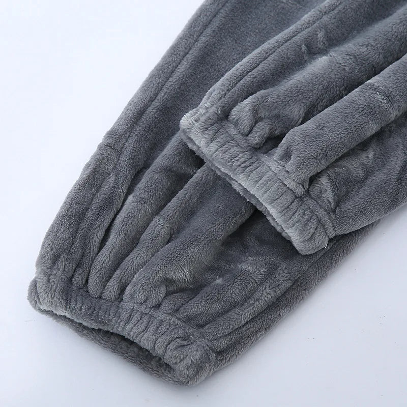 Full view of men's winter pyjamas set laid flat for display