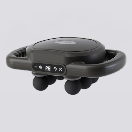 Lifestyle image of the portable body massager resting on a yoga mat