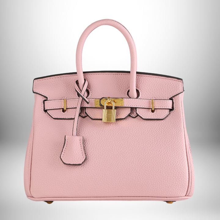 Lifestyle view of the luxury purse paired with professional attire