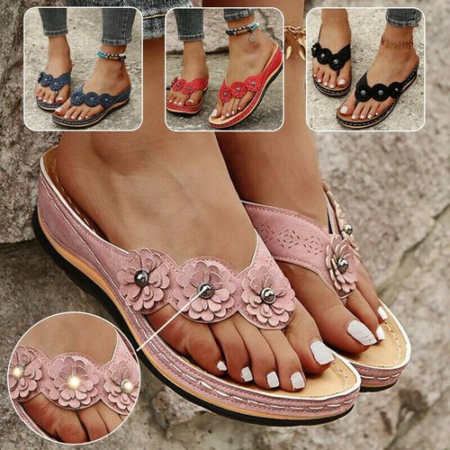 Textured outsole and wedge heel of orthopaedic beach sandals