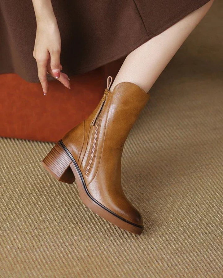 Pair of black ankle boots with comfortable block heel ready to wear