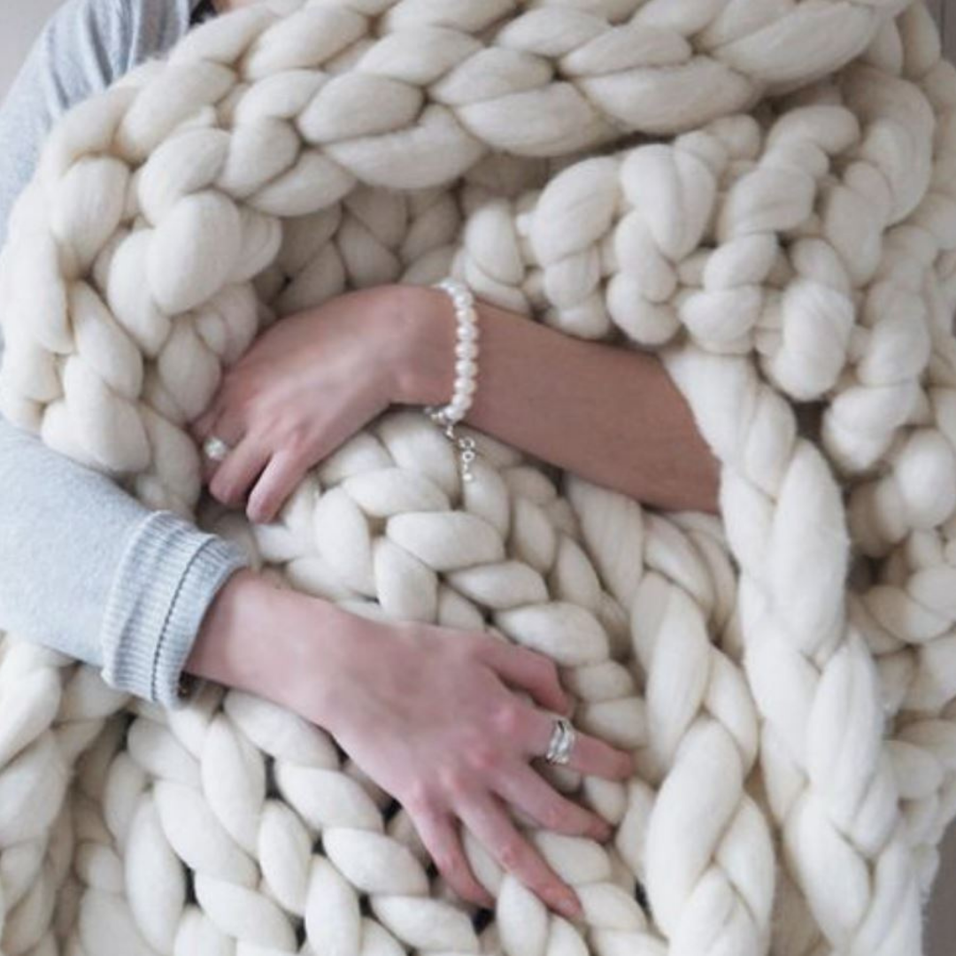 Soft chenille yarn balls arranged for a DIY chunky knit craft project