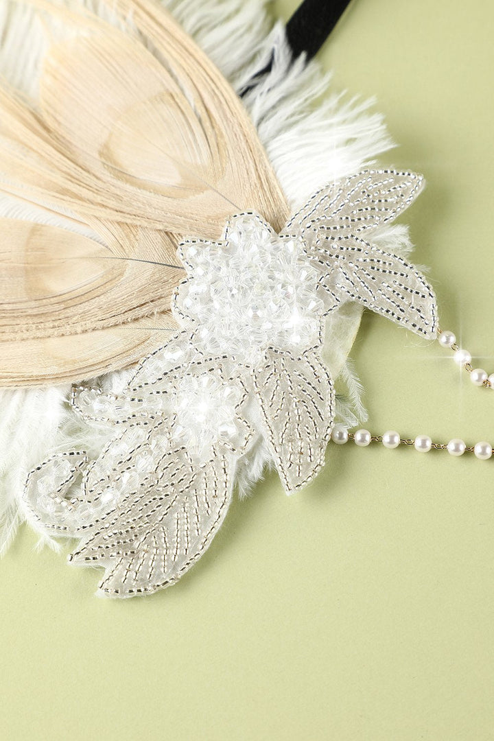 Elegant feather hair band styled as a vintage 1920s headpiece for themed parties