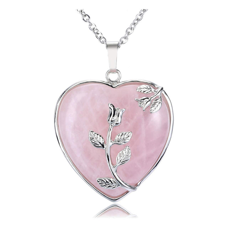 Detailed shot of the crystal heart pendant and secure silver clasp