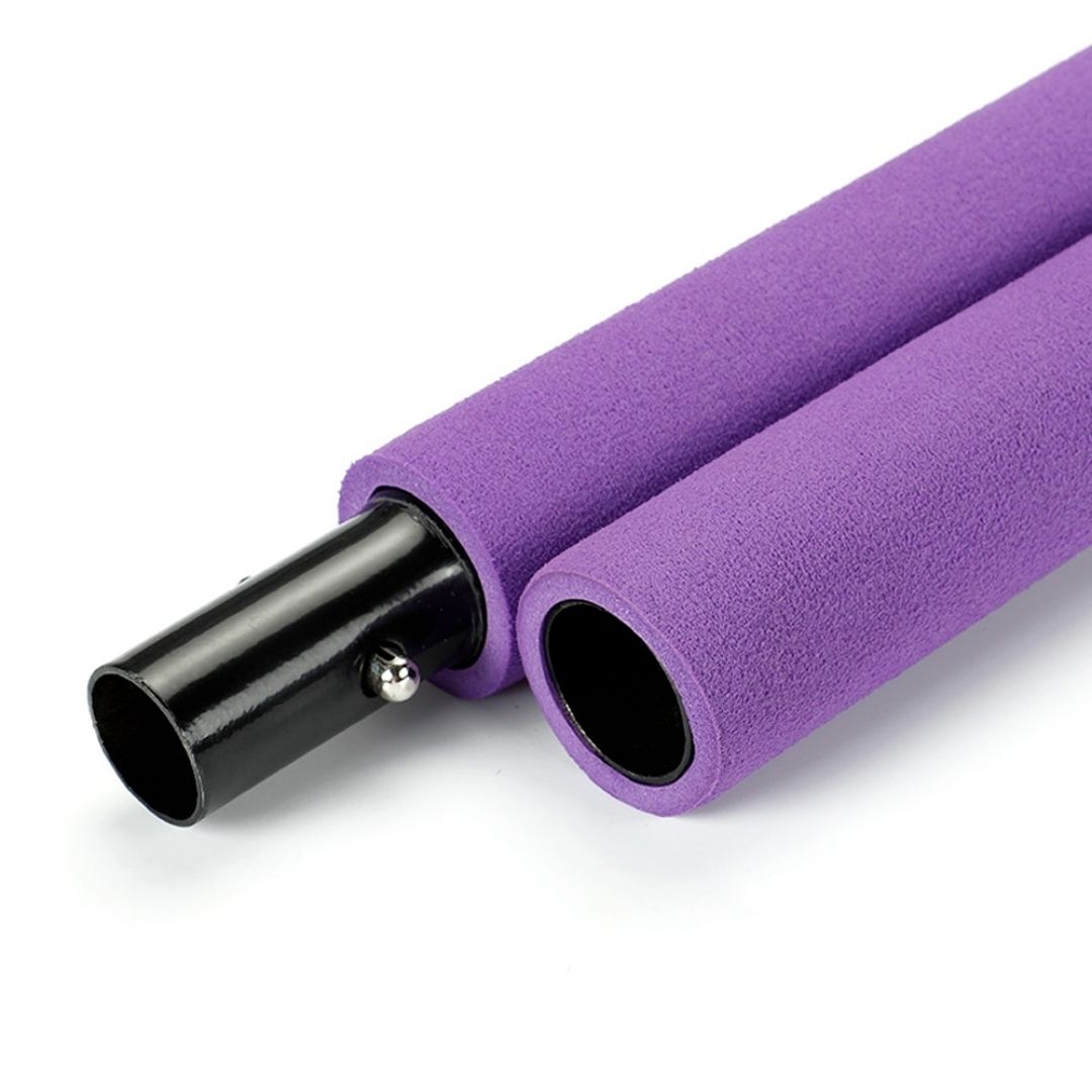 Assembled multifunctional Pilates bar kit laid flat with resistance bands