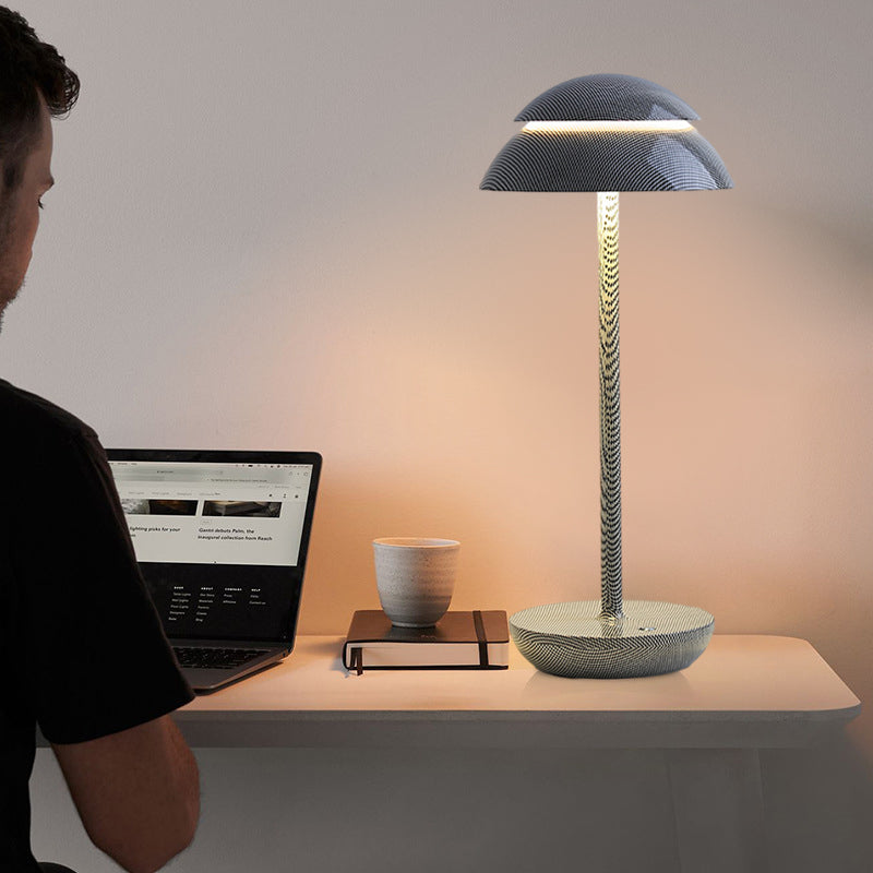 Portable rechargeable table lamp placed on a contemporary desk