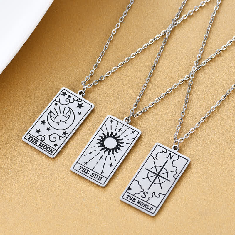 Close-up of vintage tarot card necklace showing detailed lucky symbols