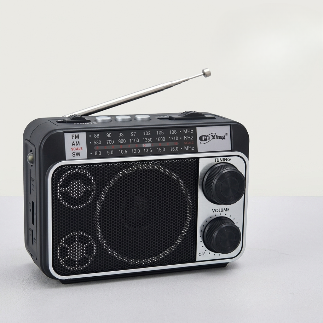 Silver portable AM FM radio with extended telescoping antenna against a white background