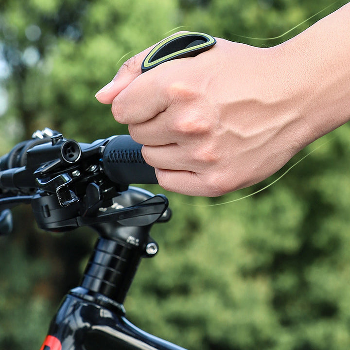 Cyclist holding ergonomic bicycle grip on handlebar
