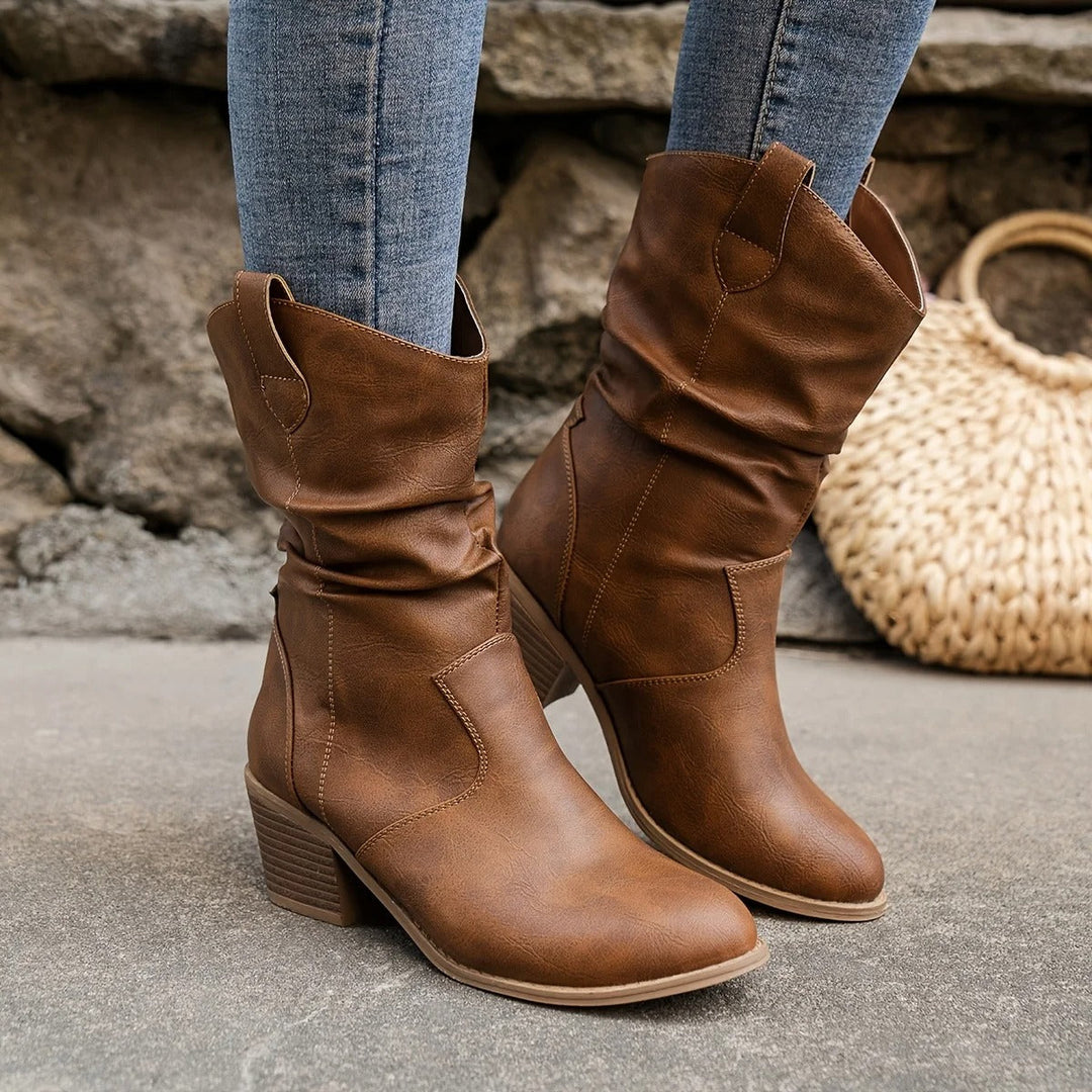 Women wearing brown slouchy mid-calf boots with comfortable block heels outdoors