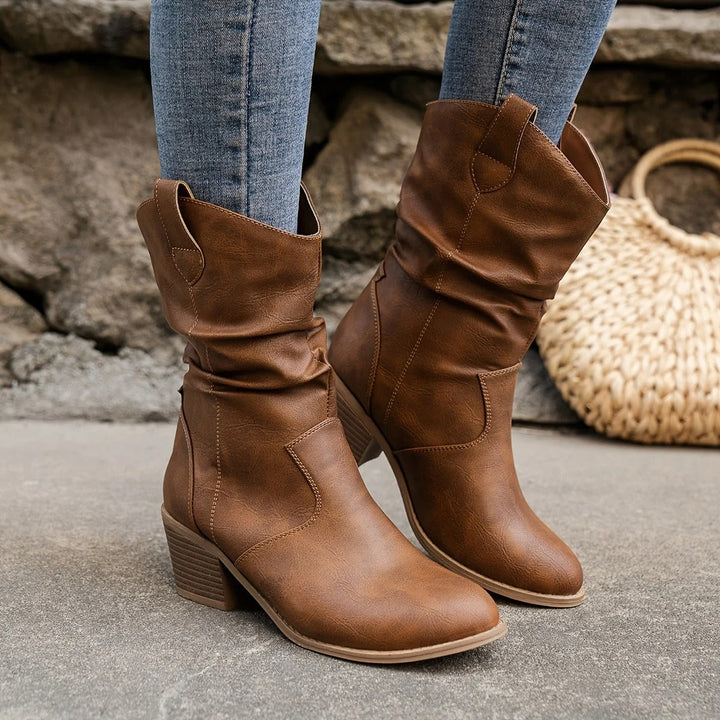 Women wearing brown slouchy mid-calf boots with comfortable block heels outdoors