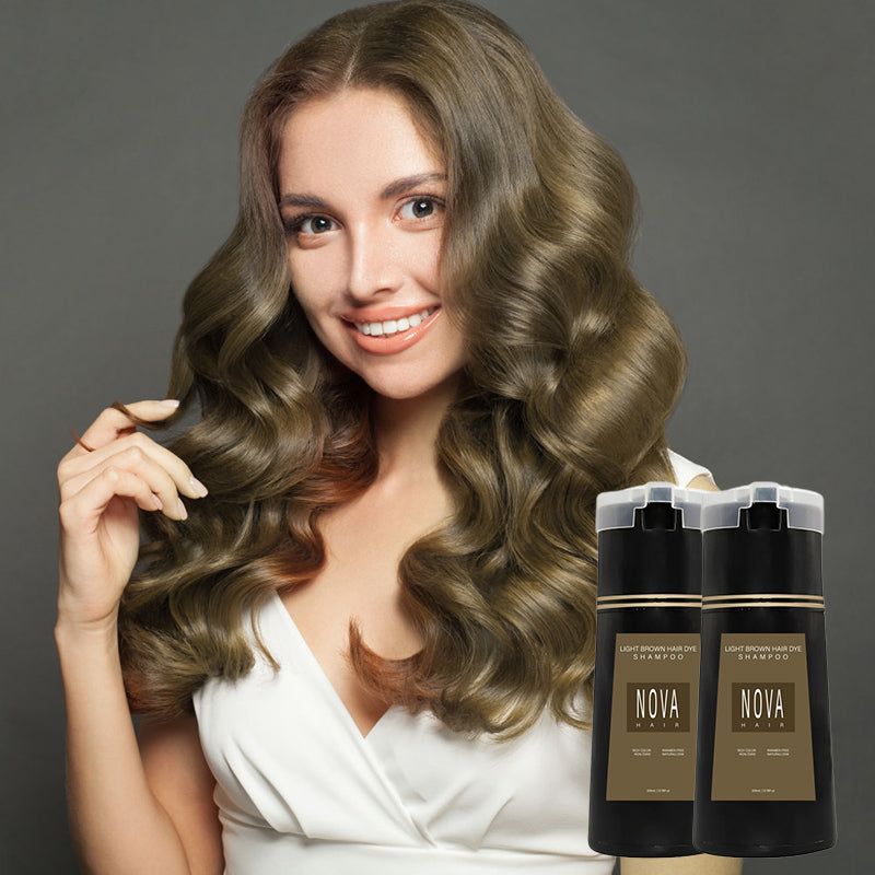 Model with beautiful light brown hair holding colour shampoo bottles