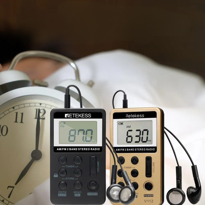 Silver and black mini pocket radio with telescopic antenna for travel and outdoors