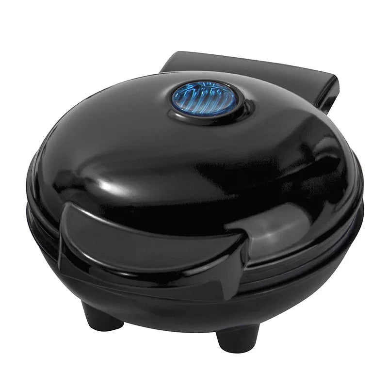 Kitchen gadget box and mini waffle maker neatly displayed on a countertop