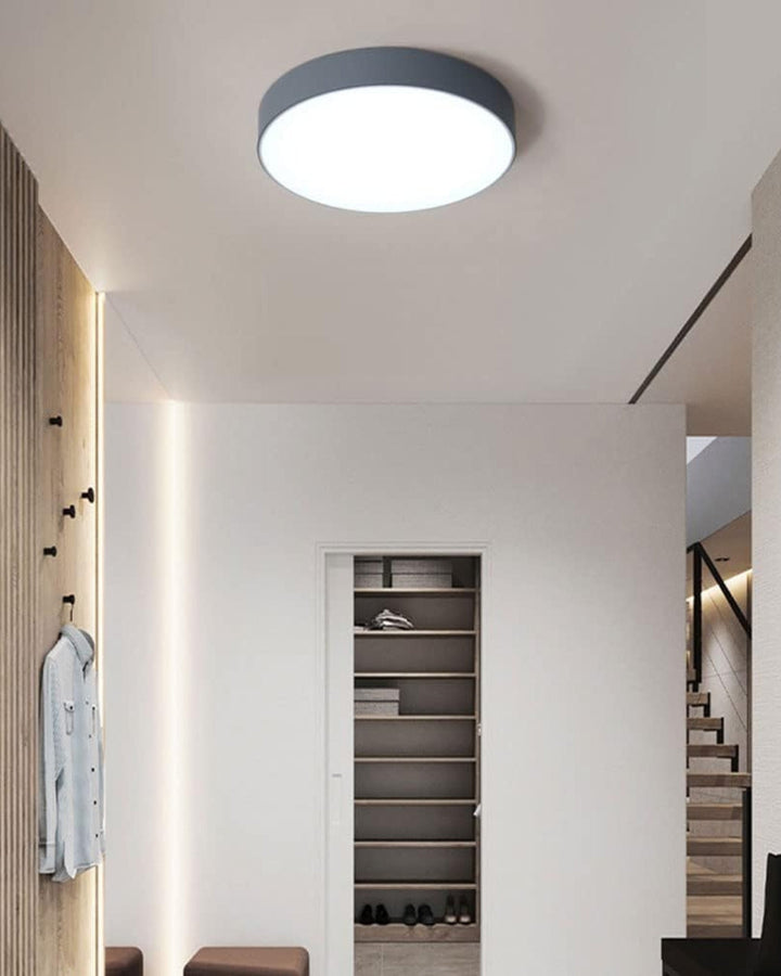 Flush mount LED ceiling lamp casting soft illumination downward