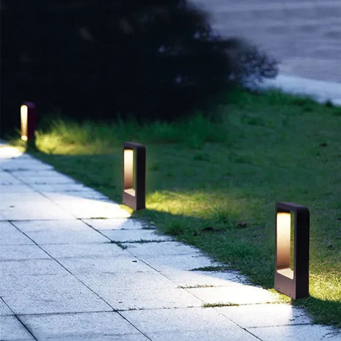 TerraBeam outdoor ground spotlight lighting a garden path at dusk